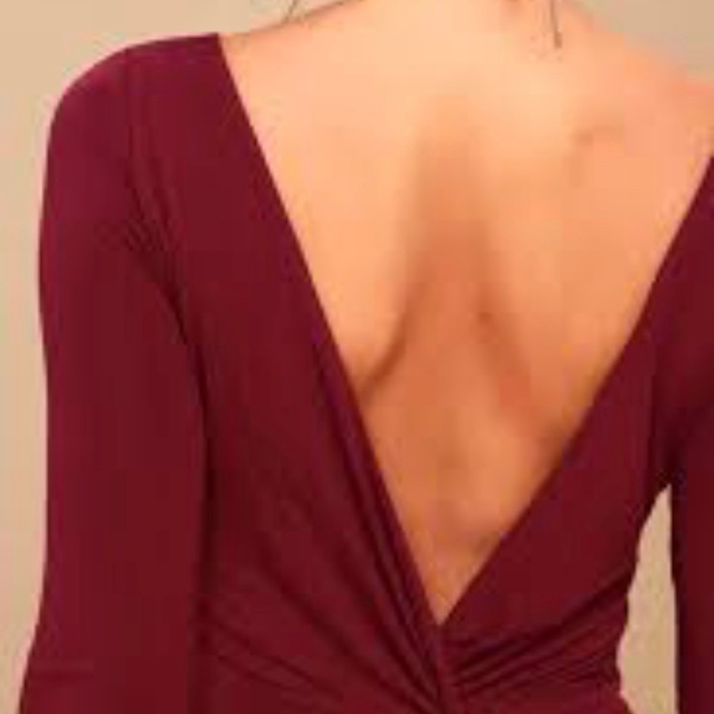 Bodycon dress with sleeves and open back.
